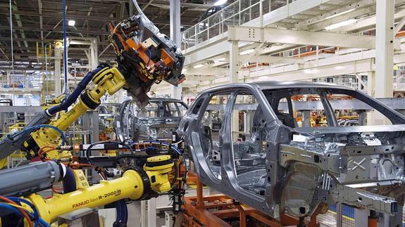 Imagen de robots industriales en fábrica